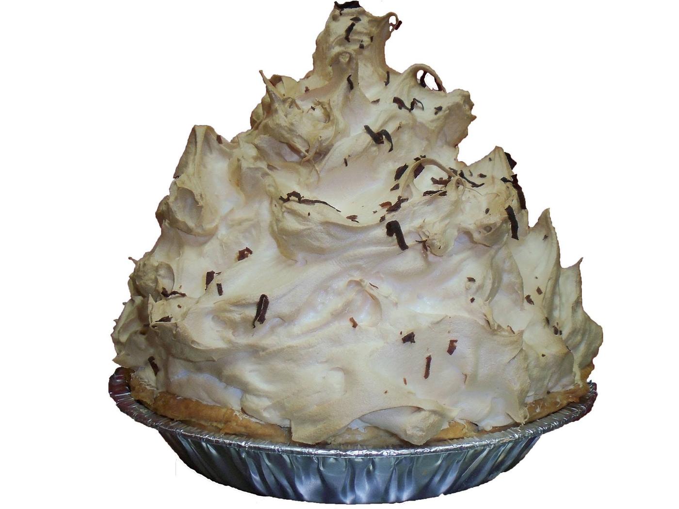 A whole mile high meringue pie in a foil dish, topped with chocolate shavings
